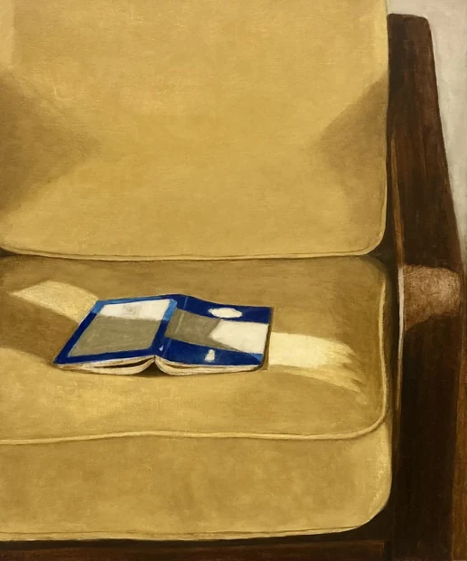 A painting of a yellow chair with an open book